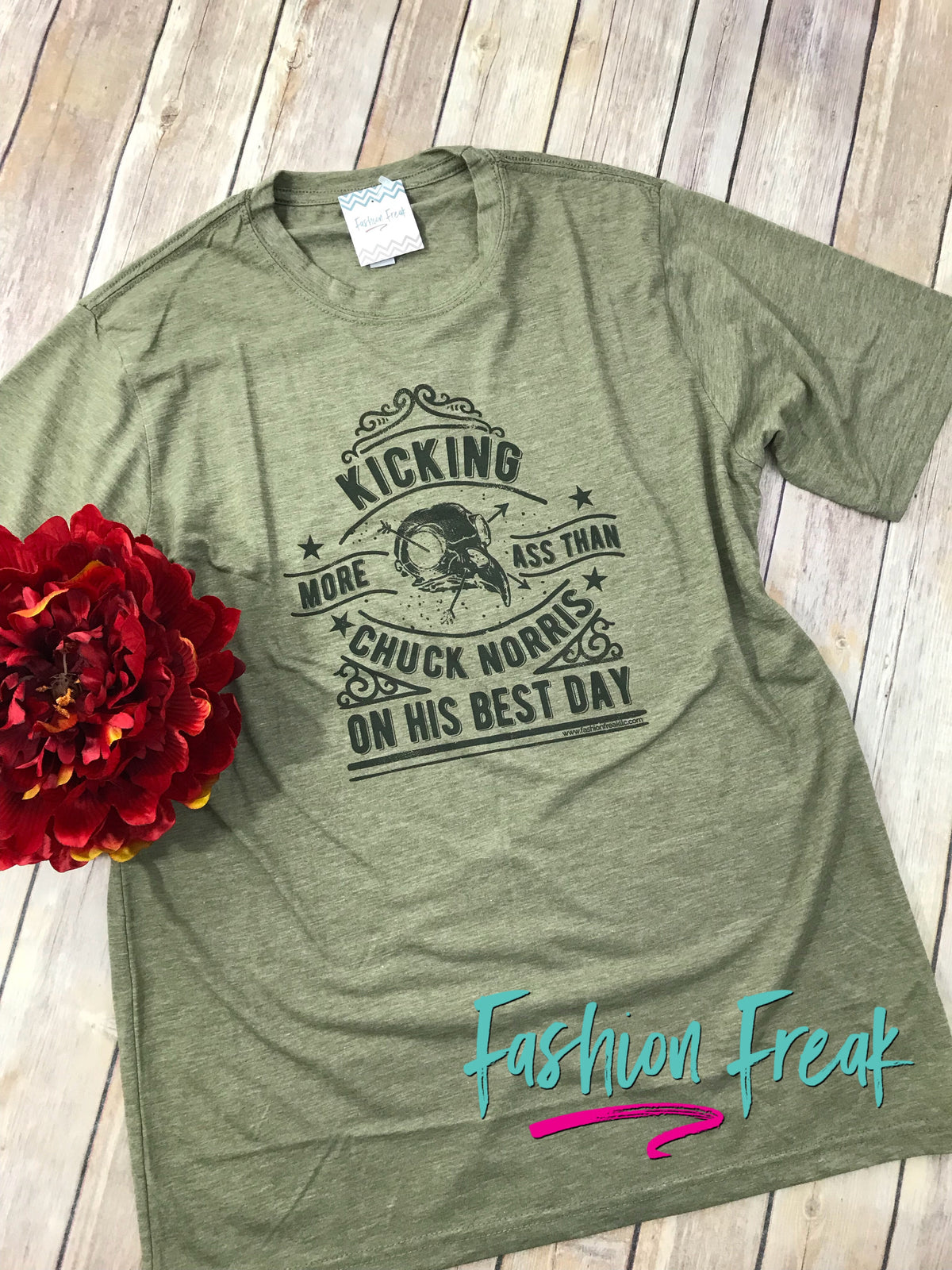Kicking More Ass Than Chuck Norris Exclusive Graphic T by Fashion Freak LLC | Unisex Olive Green