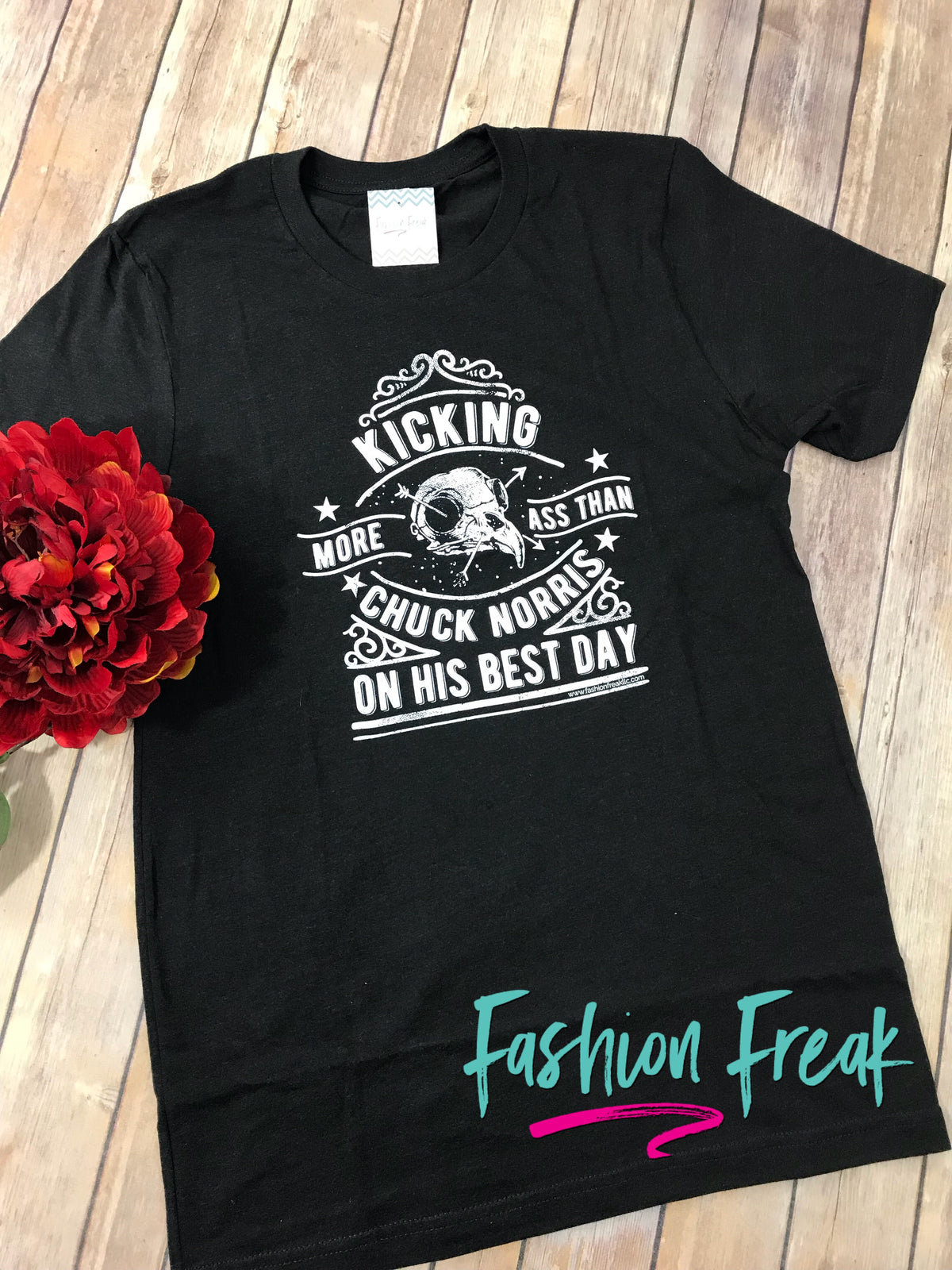 Kicking More Ass Than Chuck Norris Exclusive Graphic T by Fashion Freak LLC | Unisex Heathered Black